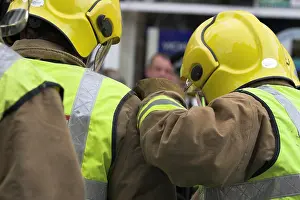 Injured Prints: emergency services treat an injured driver in a car crash scenario training exercise for drink driving
