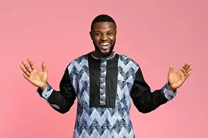 Nigeria Prints: Emotional african american young man posing at studio