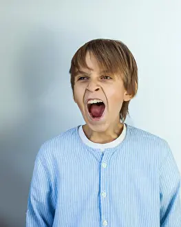 Young Child Prints: Emotional portrait of irritated shouting teen boy