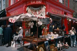 Markets Prints: ENGLAND London Portobello Road antique shop in the market with a stall outside on pavement sidewalk with tourists
