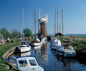 Sails Prints: England. Norfolk. Horsey Mill. Boats moored on water channel