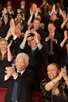 Well Dressed Prints: Enthusiastic theater audience clapping and cheering