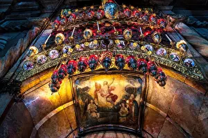 Palestine Prints: An entrance to the Aedicule in the Church of the Holy Sepulchre in Jerusalem decorated with a painting of resurrected