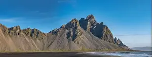 Stokksnes Prints: Epic aerial drone view flying over landscape of the black sand beach in Stokksnes on a sunny day