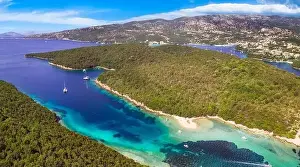 Epirus, Greece. Sivota - stunning aerial drone video of turquoise sea known as Blue Lagoon and unique beach Bella Vraka