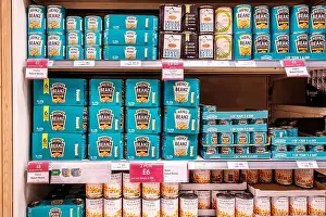 Epsom Surrey, London UK, June 10 2022, Supermarket Shelf Tins Of Heinz Baked Beans