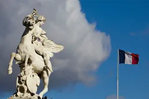 On Holiday Prints: Equestrian Stone Statue with the French flag flying in the Background in Paris France