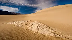 Absence Prints: Eroded and cracked clay formation at Mesquite Flat sand dunes in Death Valley National Park
