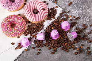 Capsules Prints: Espresso pink plastic capsules with foil and coffee beans and sweet donuts