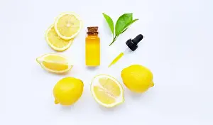 Treatments Prints: Essential oil with lemon on white background