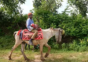 White Horse Prints: An Ethiopian man riding his white horse in the Keffa region of Ethiopia