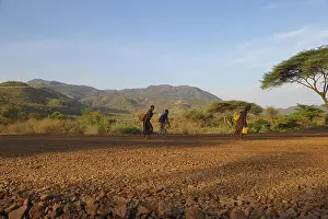 Ethiopia Prints: Ethiopian people walking with their water containers
