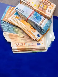 euro money banknotes, pile of money, cash, stack, new bills, isolated on blue background
