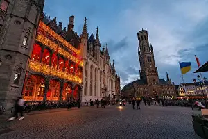 Ambience Prints: Evening scene of Gothic city hall and lit arcade in plaza