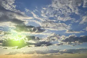Cumulus Prints: Evening sky at sunset with clouds and blue sky