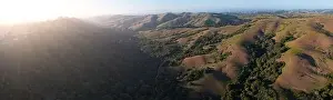 Evening sunlight shine on the serene, rolling hills of the East Bay, just east of San Francisco Bay, California. This area abuts Oakland and Berkeley
