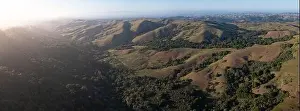 Evening sunlight shine on the serene, rolling hills of the East Bay, just east of San Francisco Bay, California. This area abuts Oakland and Berkeley