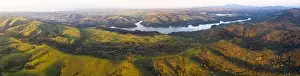 Evening sunlight shines on the green hills of the East Bay in Northern California. This open area, east of San Francisco Bay, is green in the winter