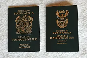 Modernized Prints: An example of an old South African passport next to a new South African passport