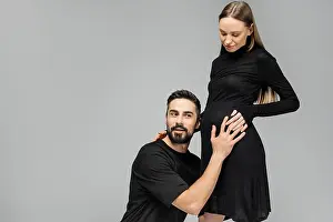 Parenthood Prints: Excited bearded man in t-shirt touching