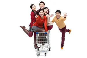 Catching Prints: Excited young friends with shopping cart in Chinese New Year