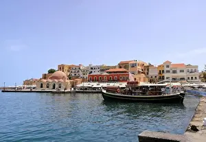 Excursion boat cruising Venetian harbour and mediterranean sea of Chania, Crete, Greece