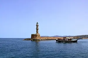 Old Port Prints: Excursion boat cruising Venetian harbour and mediterranean sea of Chania, Crete, Greece