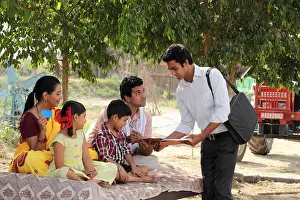 Sibling Prints: Executive taking signature of a farmer