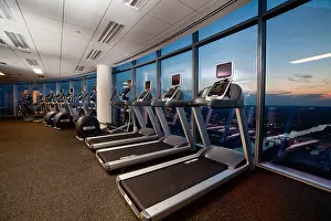 Gymnasium Prints: Exercise gym facility in a luxury highrise in Austin, Texas during sunset