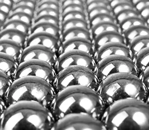 Spherical Prints: Exposed metal gray balls in a row