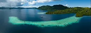 Melanesia Prints: Extensive coral reefs fringe rainforest-covered islands in the Solomon Islands