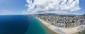 Beachfront Prints: Extremely wide angle panoramic aerial photo of the city of Benidorm in Spain showing a panoramic drone view of