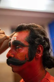 Transformation Prints: Third eye being drawn on the forehead of the man dressed as Virabhadra for the annual folk dance performance at Vithoba