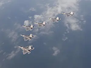 Aircrew Prints: Six F-22 Raptors from the 95th Fighter Squadron conduct formation flight over the Gulf of Mexico as part of a local