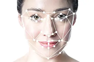 Detection Prints: face detection or facial recognition grid overlay on face of woman