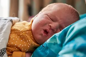 Slumber Prints: The facial expressions of a new born baby girl