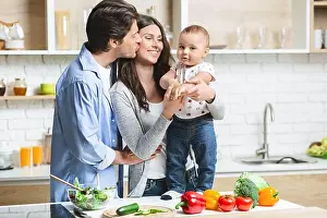 Parenting Prints: Family Enjoying Quality Time Together While Preparing Healthy Meals in a Modern Kitchen