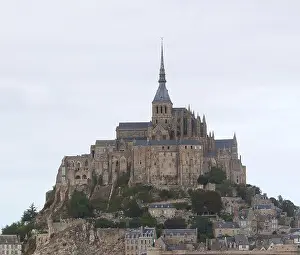 Low Tide Prints: Famous Mont Saint Michel abbey above the hill of the island during low tide in Northern France