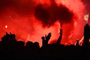 Santiago Prints: Fans burning flares.Around 3, 000 PSG fans gathered on the streets close to Santiago Bernabeu stadium ahead of the UEFA