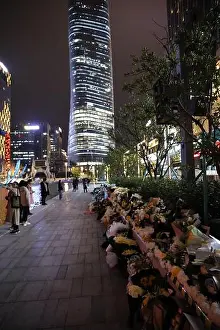 Taiwanese Prints: Fans lay individual wreathes and flowers at the recording scene in memorial of Godfrey Gao