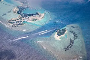 Fantastic aerial landscape, luxury tropical resort or hotel with water villas and beautiful beach scenic. Amazing bird eyes view in Maldives landscape