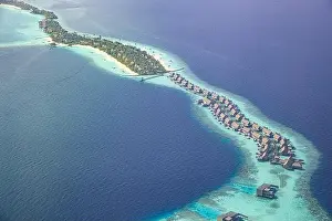 Fantastic aerial landscape, luxury tropical resort or hotel with water villas and beautiful beach scenic. Amazing bird eyes view in Maldives landscape