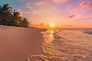 Fantastic closeup view of calm sea water waves orange sunrise sunset sunlight. Tropical island beach landscape, exotic shore coast. Summer vacation