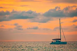Yachting Prints: Fantastic sailboat on tropical sea in sunset or sunrise time