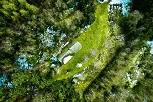 Glade Prints: Fantastic, scenic drone view of an alpine hut with associated pasture surrounded by bare birch trees in a mixed forest