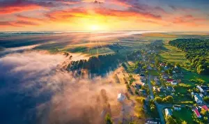 Fantastic summer sunrise on Ternopil outskirts with asphalt road