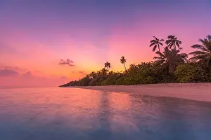 Fantastic tranquil closeup view of calm sea water waves with orange sunrise sunset sunlight. Tropical island beach landscape, exotic shore coast