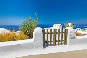 Images Dated 26th July 2021: Fantastic travel background, Santorini urban street landscape. Blue door or gate stairs