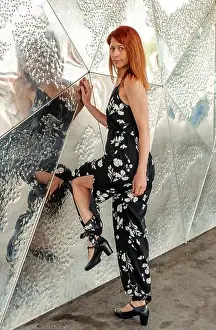 Redhead Prints: Fashion model posing with reflective metallic background