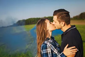 Amorous Prints: Fashion portrait of young couple in love posing at field